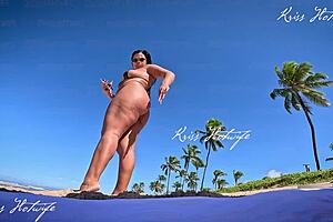 Tanned beauty flaunts big tits and ass outdoors publicly