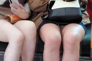 Pretty Asian girls flashing their panties on the train