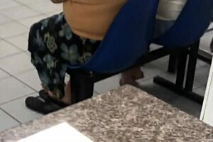 Hispanic women in flannel skirts in candid laundromat shots