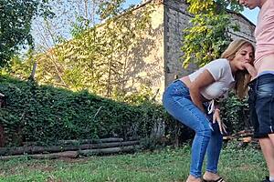 My neighbor, a hot milf, gives me a blow job outside