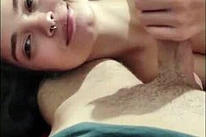 A young brunette gives a deep blow job to her man on a cold day