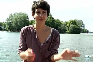 A small boat on the water with a young and pretty German amateur who pleases herself