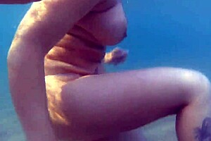 Amazing amateur blonde gives blow job in the sea