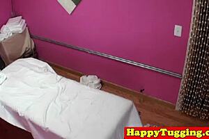 Beautiful Asian massage therapist with large breast gives a great hand job and facial