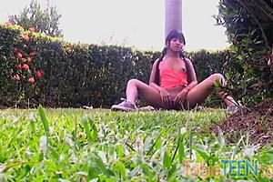 Tobie the teen enjoys solo fingering outdoors in the summer