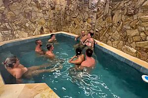A hot and steamy group sex session by the motel pool with friends