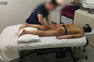 Skinny teen gets a hot massage from a sexy masseuse