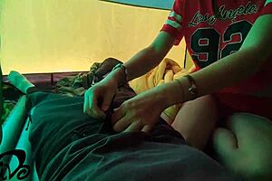 A beautiful woman with black skin has rough sex in a dorm tent and cums on her face