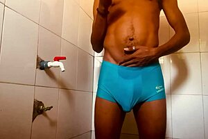 Gay solo scene with a black star masturbating in the bathroom while his step-sister has sex in another room