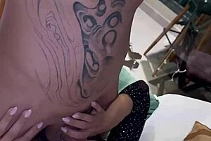 Hot blonde gives a cum shower to a tattooed stud