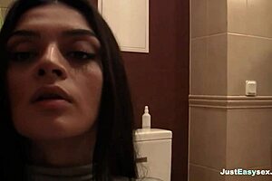 Amateur with big cans self-pleasure by stroking her bush