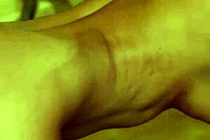Petite brunette MILF undresses for a sensual solo striptease