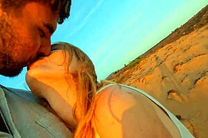 A beautiful European girlfriend gives a blowjob to her fat boyfriend in the desert