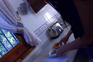 An Asian girl is fucking in the kitchen, getting wild with a guy