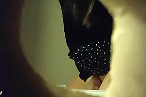Spy cam video of a babe peeing through a wall hole
