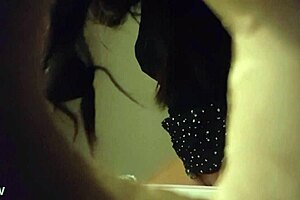 Spy cam video of a babe peeing through a wall hole