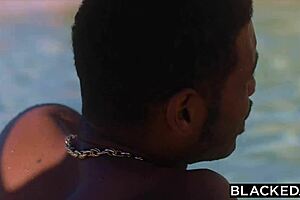 The black guy has sex with Penelope in the pool secretly